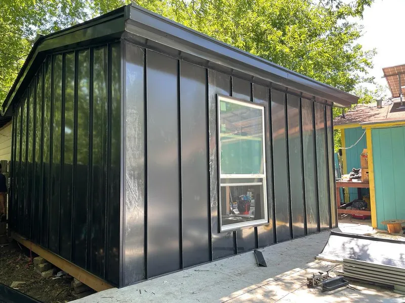 Black standing seam metal wall panels for Roof Inspection in La Junta